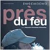Près du feu : affiche